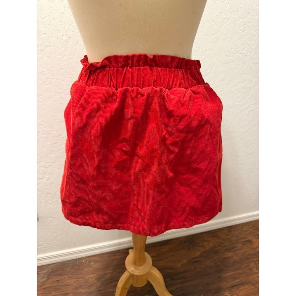Red corduroy mini skirt with pockets